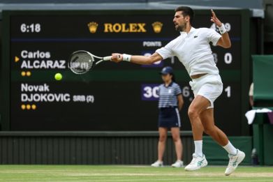 Hitting out: Novak Djokovic returns the ball to Carlos Alcaraz
