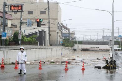 Heavy rains have swept across northern Japan where a man was found dead in a flooded car on Sunday