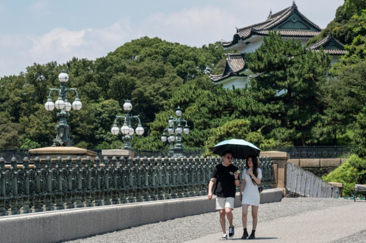 Many have sought shelter from the sun's rays under umbrellas