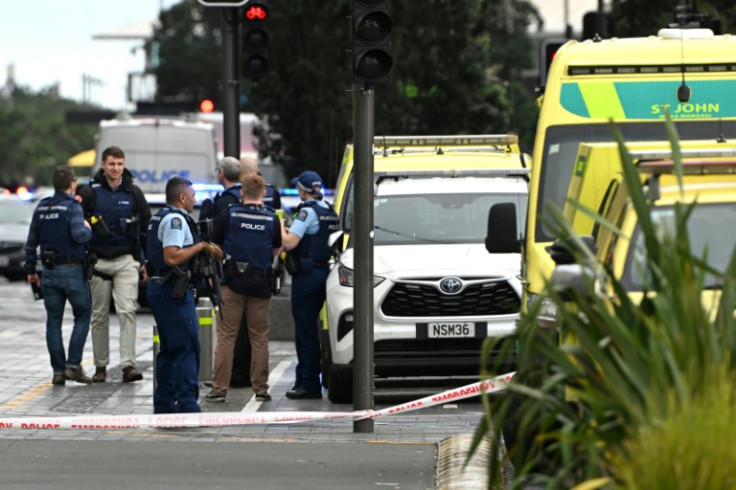 Police officers cordon off the site of a shooting in central Auckland on Thursday