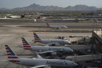 American Airlines reported record quarterly revenues as travel demand stayed strong