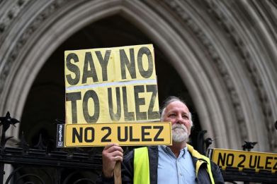 A protester against London's new Ultra Low Emission Zone (ULEZ)