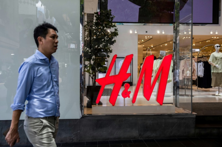 A man infront of a retail store