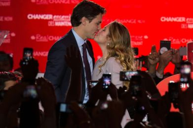 In happier times in 2015, Canadian Prime Minister Justin Trudeau and his wife share a kiss