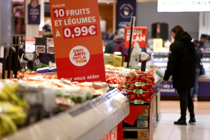 A woman in  a supermarket shopping