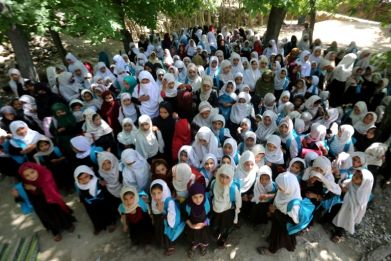 Afghan school girls attend at an open-air primary school in Khogyani district of Nangarhar province in May 2023