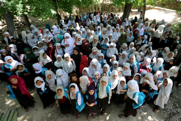 Afghan school girls attend at an open-air primary school in Khogyani district of Nangarhar province in May 2023