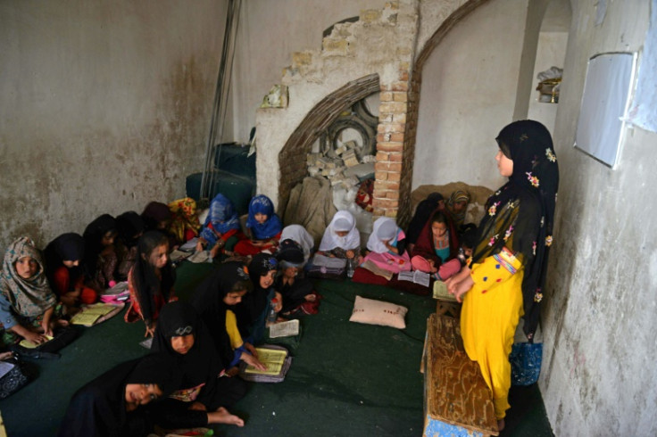 Afghan girls read Koran during the holy fasting month of Ramadan at a madrassa in Kandahar, Afghanistan in April 2023