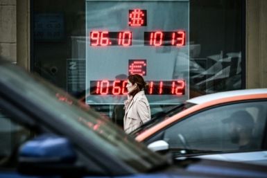 A woman walks past a currency exchange office in Moscow on August 14, 2023, the day the Russian ruble hit its lowest level against the dollar since March 23, 2022 -- shortly after Moscow launched its military operation in Ukraine