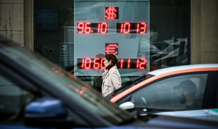 A woman walks past a currency exchange office in Moscow on August 14, 2023, the day the Russian ruble hit its lowest level against the dollar since March 23, 2022 -- shortly after Moscow launched its military operation in Ukraine