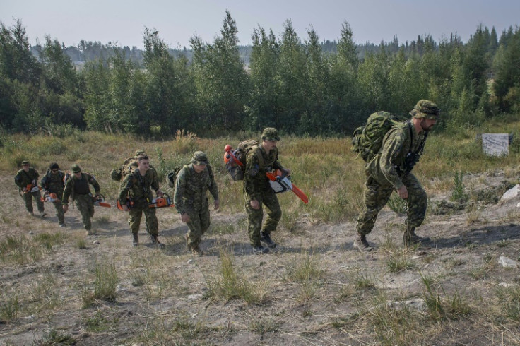Canadian troops construct firebreaks to fight wildfires in the vicinity of Yellowknife and Dettah in the Northwest Territories