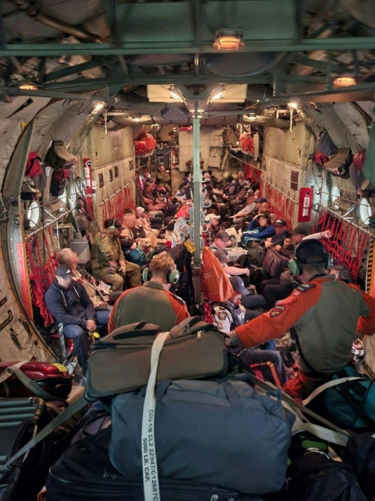 This handout photo provided by the Canadian Armed Forces shows Royal Canadian Airforce aircraft airlifting residents of Fort Smith to Fort McMurray in Canada this week