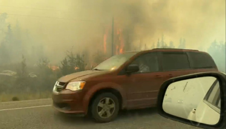 This screengrab from a video shows vehicles fleeing on the highway out of Yellowknife