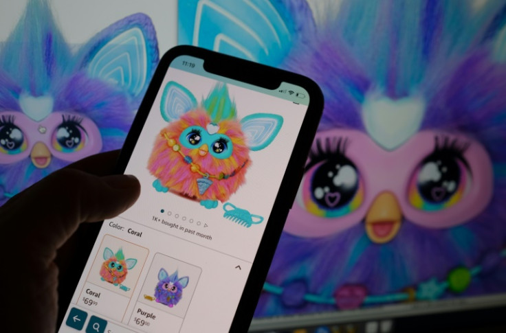 This illustration photo shows a smartphone screen with the recently relaunched Furby toy now on sale
