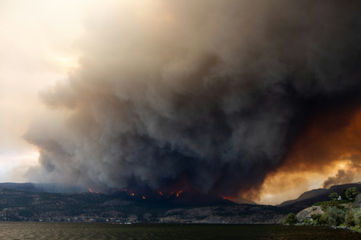 The McDougall Creek wildfire burns in the hills of West Kelowna. Evacuation orders were put in place in the area of Kelowna, with a population of 150,000, as the fire threatened the city