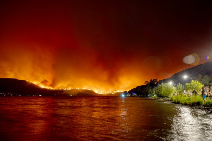 Residents watch the McDougall Creek wildfire in West Kelowna