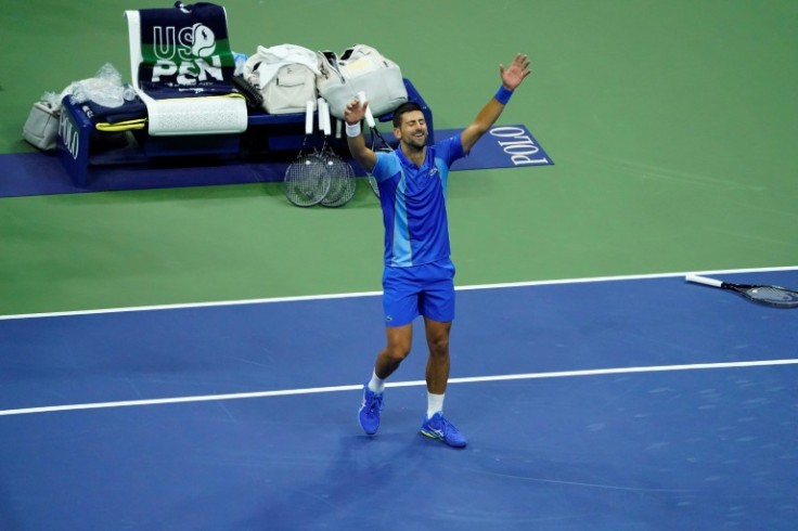 History man: Novak Djokovic celebrates winning his record-equalling 24th Grand Slam at the US Open
