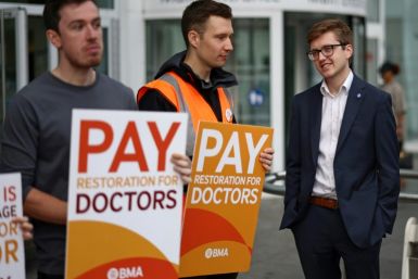 Strikers demand better pay for junior doctors on a picket line outside University College Hospital in central London