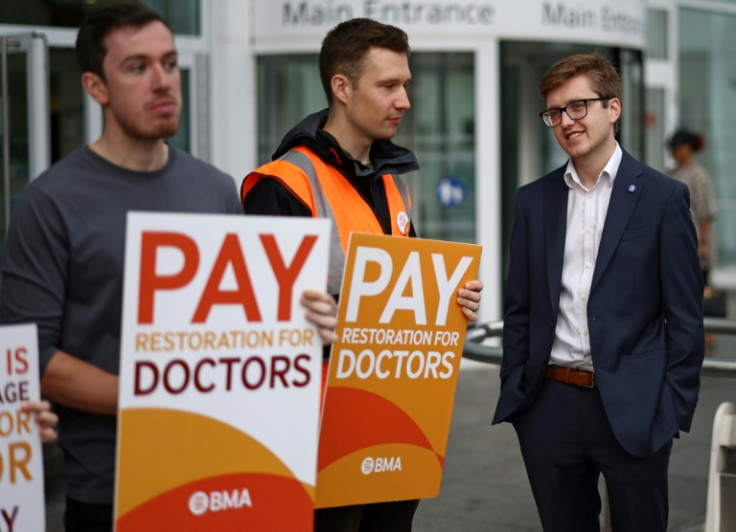 Strikers demand better pay for junior doctors on a picket line outside University College Hospital in central London