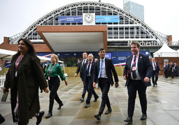 UK Prime Minister Rishi Sunak (2nd R) arrives at the annual Conservative party conference in Manchester, northwest England, on October 1, 2023