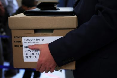 A box is carried to the opening day of the civil fraud trial against former president Donald Trump