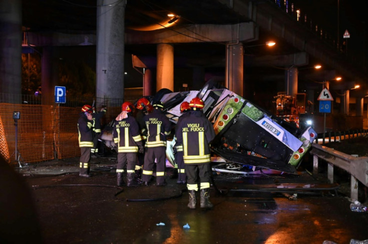 Firefighters said the bus caught fire after careering off a bridge straddling a railway line