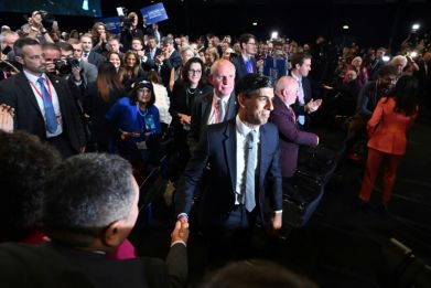 Rishi Sunak shakes hands with delegates after his speech at the annual Conservative Party Conference