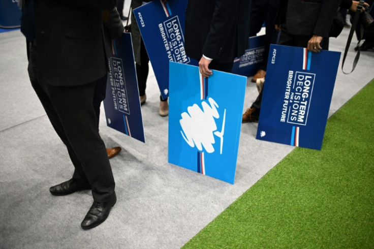 Delegates hold placards at the annual Conservative Party Conference in Manchester