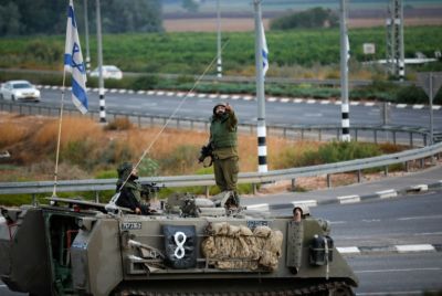 An armored Israeli vehicle is seen near the border with Lebanon on October 15, 2023