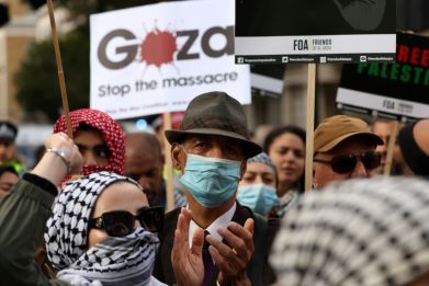 People take part in a pro-Palestinian demonstration in London on October 14, 2023