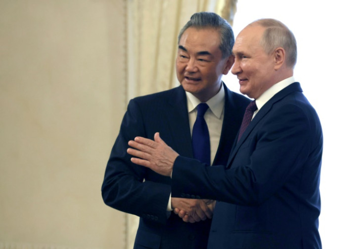 Putin told Chinese Foreign Minister Wang Yi in Saint Petersburg last month that he had 'gladly accepted' Xi's invitation to visit China