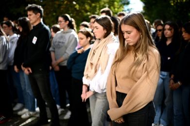 Pupils and school staff across France observed a minute of silence Monday for the slain teacher