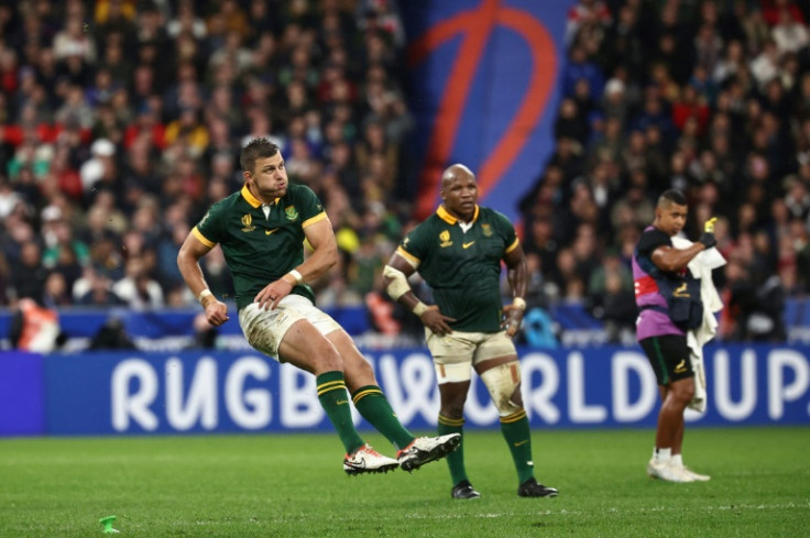 South Africa's fly-half Handre Pollard kicks the winning penalty for South Africa against England at the Stade de France