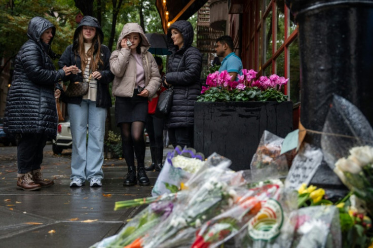 Fans leave flowers outside the New York apartment building where the TV show 'Friends' was set