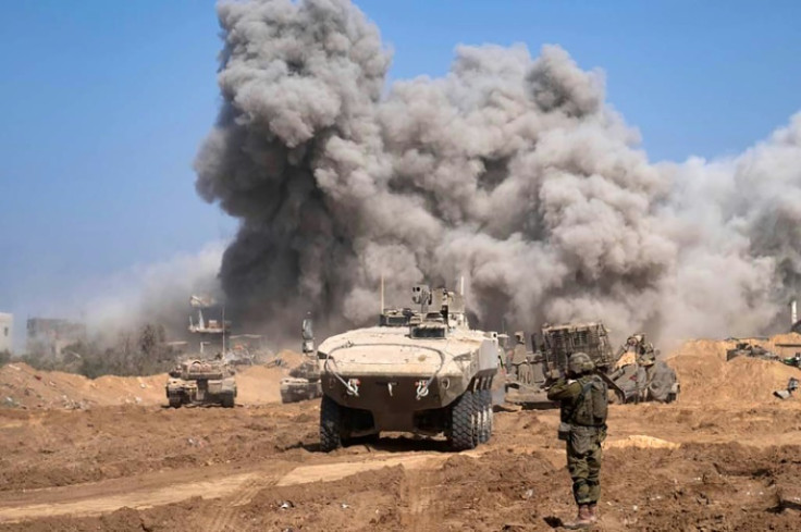 A picture released by the Israeli army on November 5, 2023 shows Israel military vehicles and heavy smoke inside the Gaza Strip as battles between Israel and the Palestinian Hamas movement continue