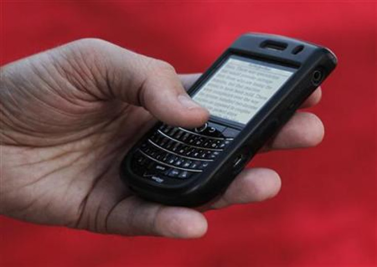 A Blackberry Tour device is shown in use in Hollywood
