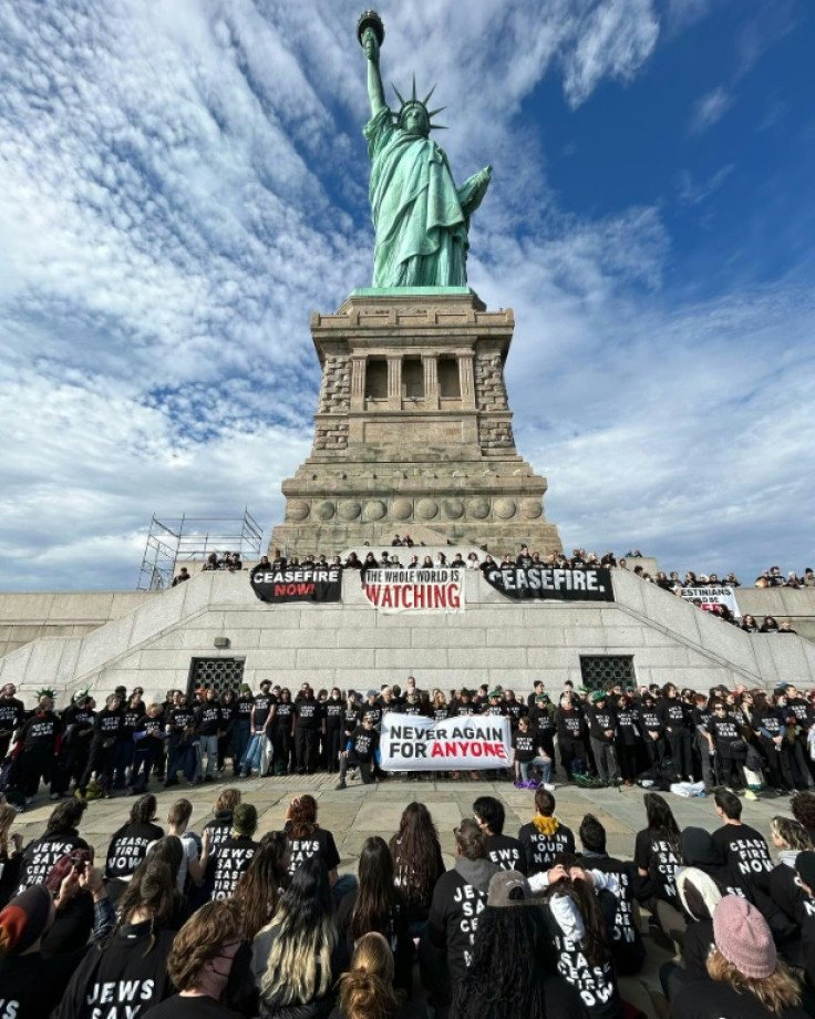 This handout picture from the Jewish Voice for Peace shows activists protesting at the Statue of Liberty in New York on November 6, 2023