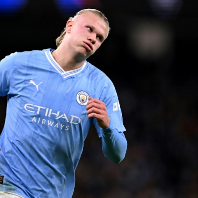 Erling Haaland scored twice as Manchester City beat Young Boys to clinch a place in the last 16 of the Champions League