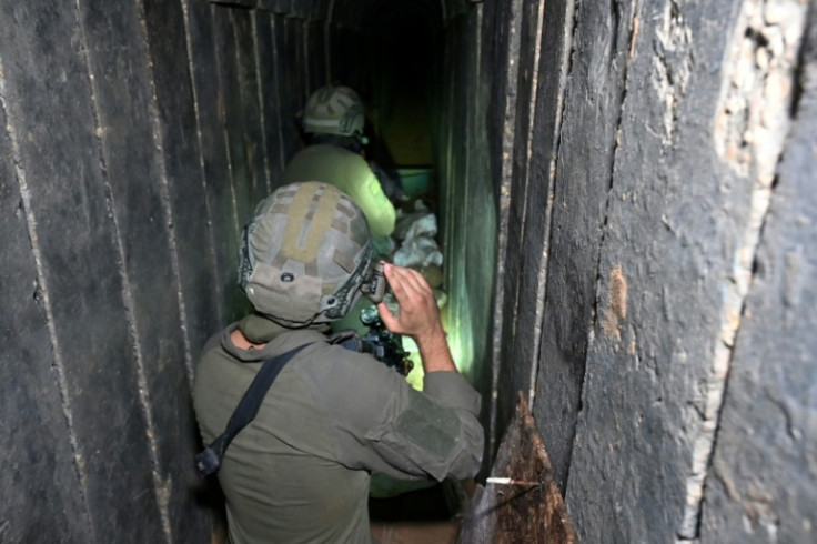 --PHOTO TAKEN DURING A CONTROLLED TOUR AND SUBSEQUENTLY EDITED UNDER THE SUPERVISION OF THE ISRAELI MILITARY-- Soldiers walk through what the Israeli army says is a tunnel dug by Hamas militants inside the Al-Shifa hospital complex in Gaza City