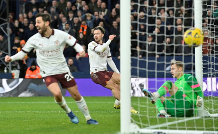 Manchester City fought back to win 2-1 at Luton