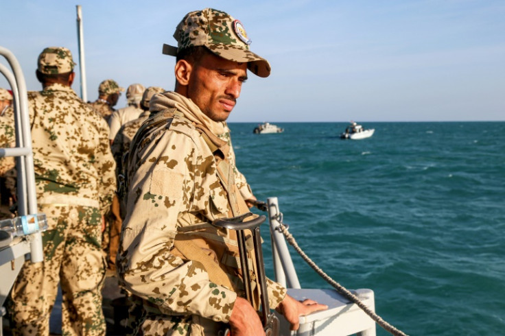 A Yemeni coastguard member loyal to the internationally-recognised government rides in a patrol boat in the Red Sea close to the strategic Bab al-Mandab Strait