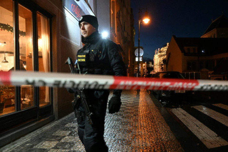 A police officer secures the area near the Charles University in central Prague