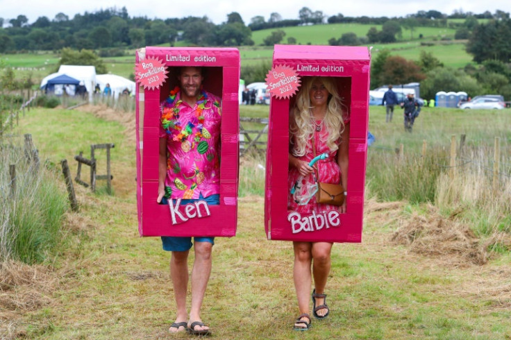 Competitors dressed as Barbie and Ken arrive to the World Bog Snorkelling Championships held at the Waen Rhydd peat bog in Wales, on August 27, 2023