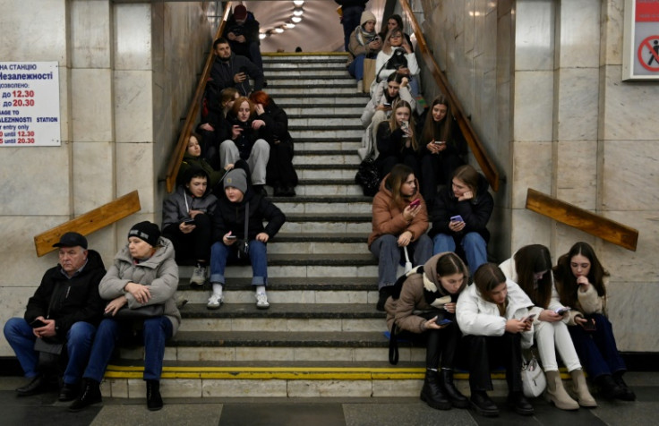 People take shelter in a subway station after a Russian missile attack in Kyiv, on December 29, 2023