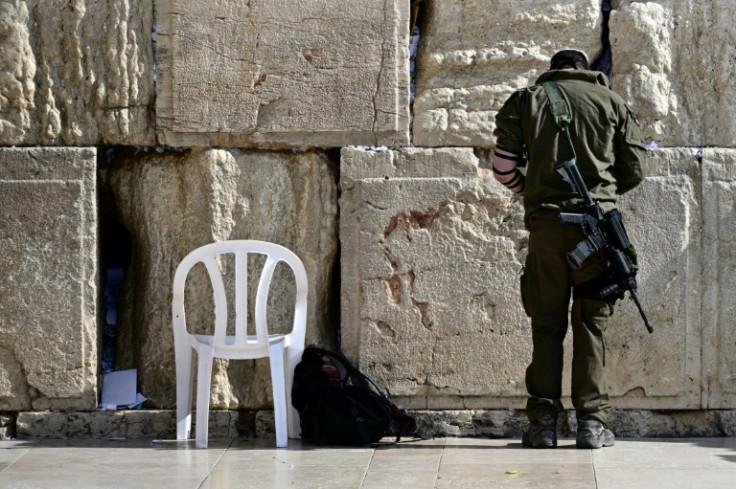 An Israeli soldier prays at the Western Wall in Jerusalem, on January 1, 2024 as the battles between Israel and the militant Hamas group continue in the Gaza Strip