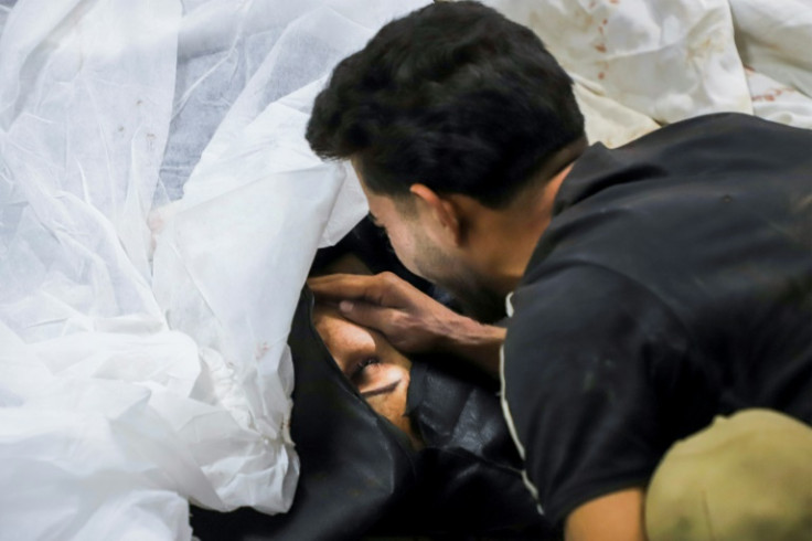 A man mourns a victim, at a hospital in the southern Iranian city of Kerman