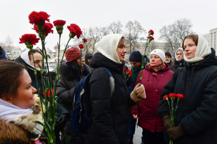 Wives of Russians mobilised to fight in Ukraine symbolically laid flowers at the flame of the unknown soldier