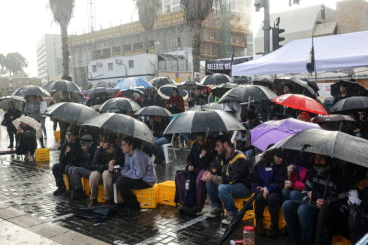 It was cold and rainy as people gathered to mark the 100th day since the attack