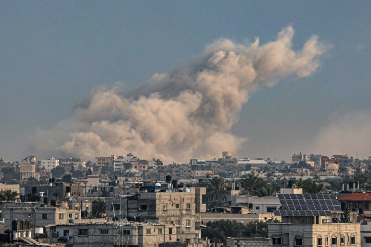 Smoke billowing over Khan Yunis in the southern Gaza Strip during Israeli bombardment