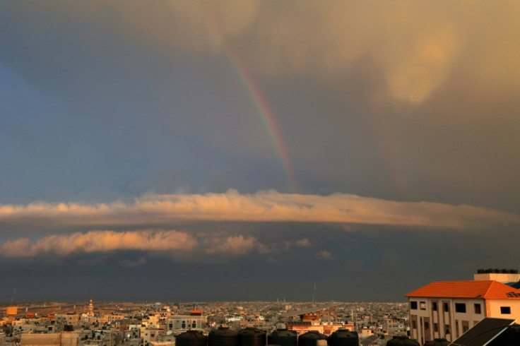 Seen from Rafah, the southern Gaza Strip, a rainbow appears amid ongoing battles between Israel and the Palestinian militant group Hamas